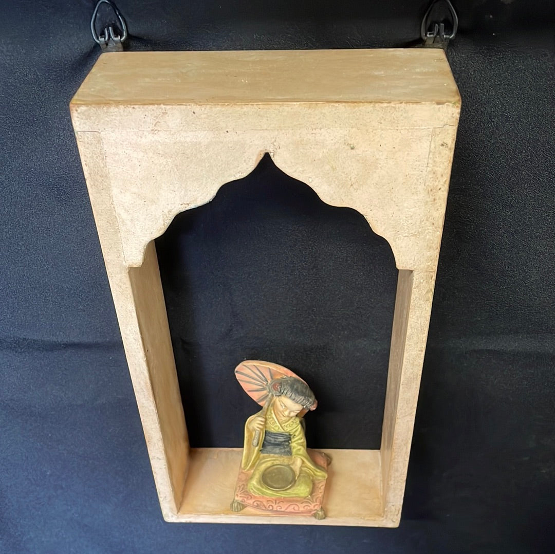 Single Indian wooden temple arch shelf light beige distressed finish.
