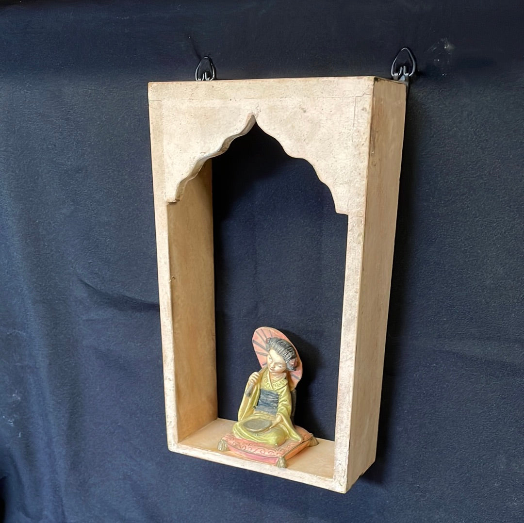 Single Indian wooden temple arch shelf light beige distressed finish.