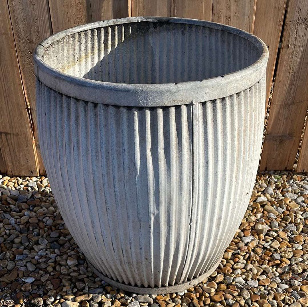 Vintage zinc dolly tub with fluted sides.