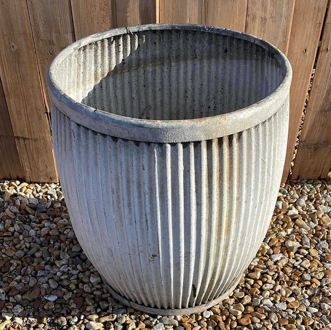 Vintage zinc dolly tub with fluted sides.