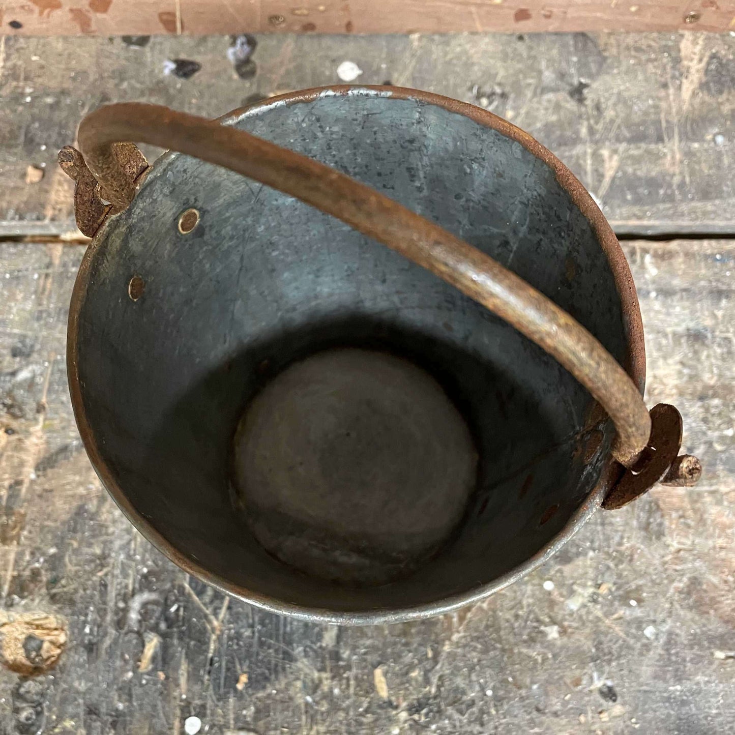 Mini metal rustic bucket with metal handle.