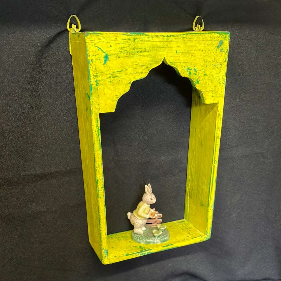 Single Indian wooden temple arch shelf yellow distressed finish.