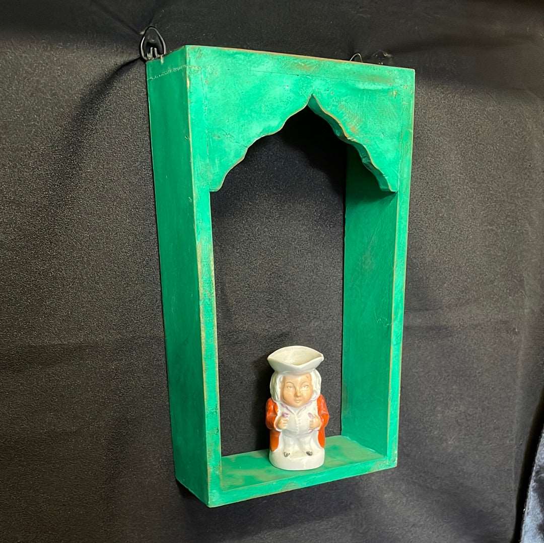 Single Indian wooden temple arch shelf green distressed finish.