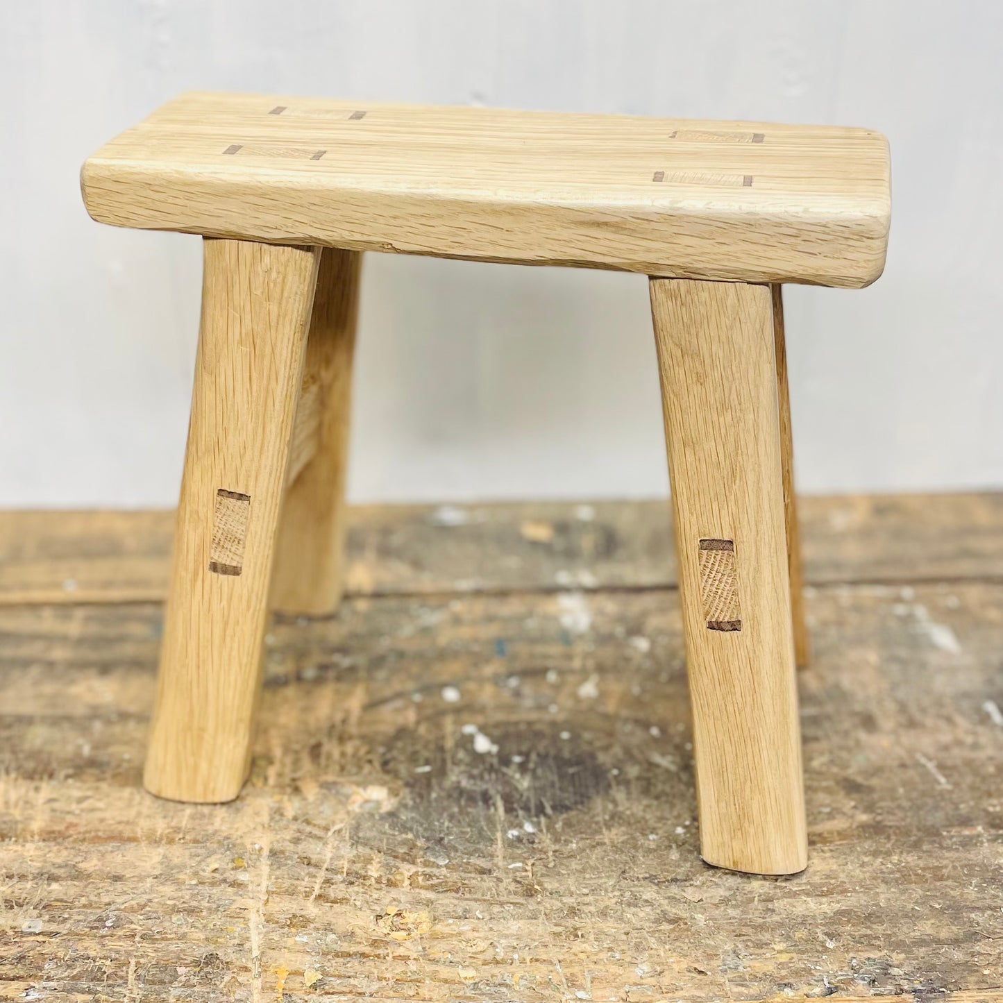 Mini handcrafted 4 legged oak wood stool.