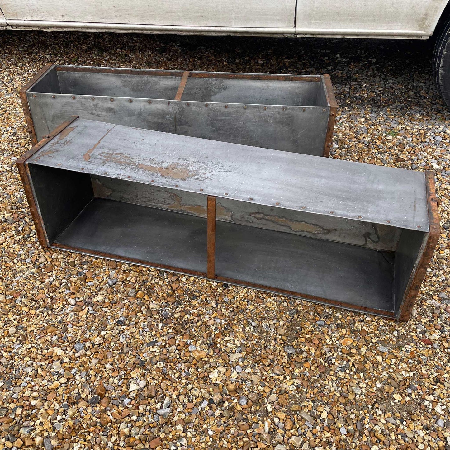 Large metal rectangular trough planter.