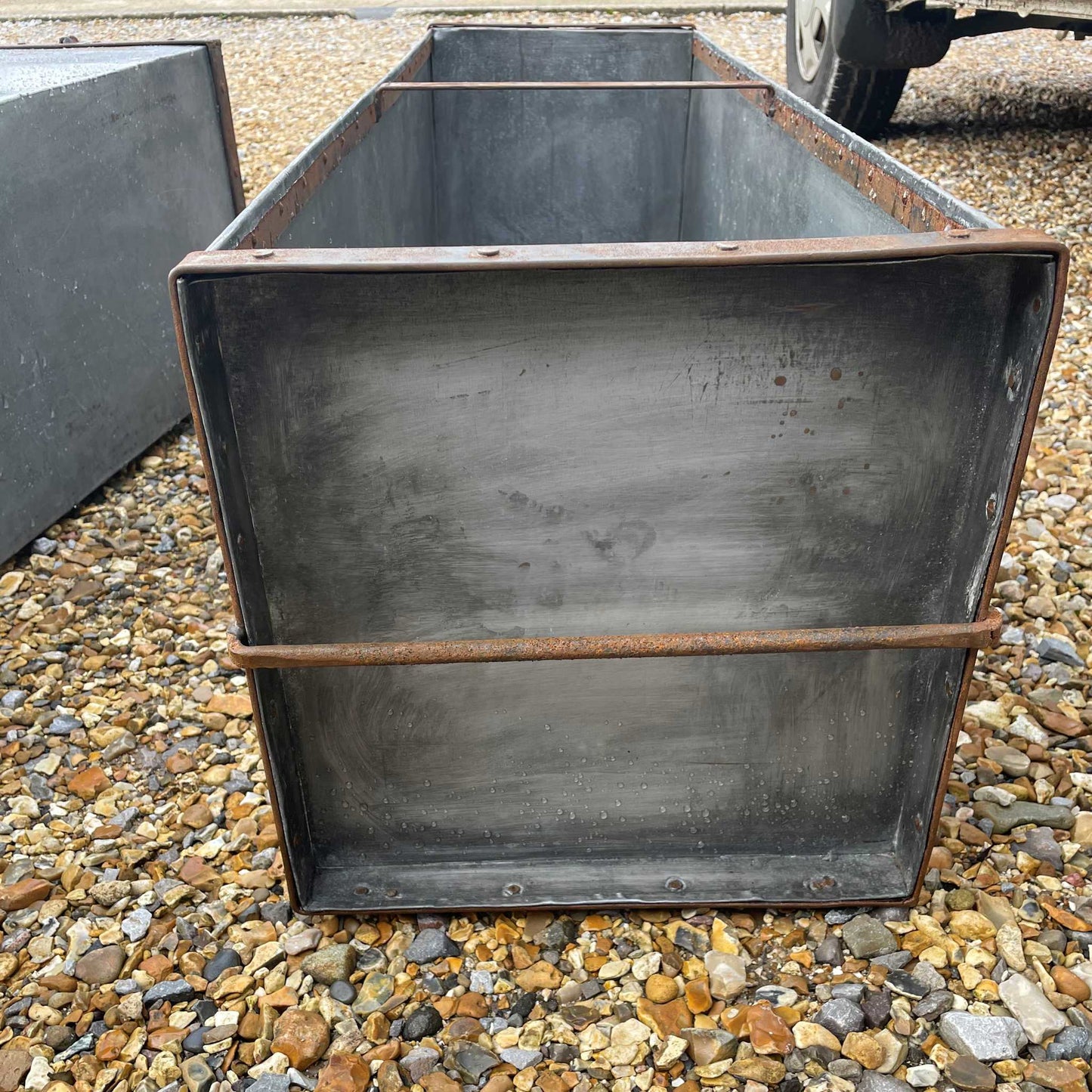 Large metal rectangular trough planter.