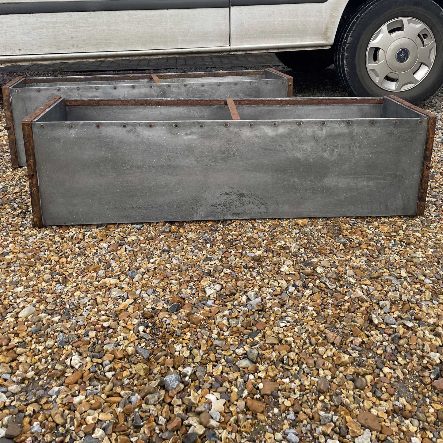 Large metal rectangular trough planter.