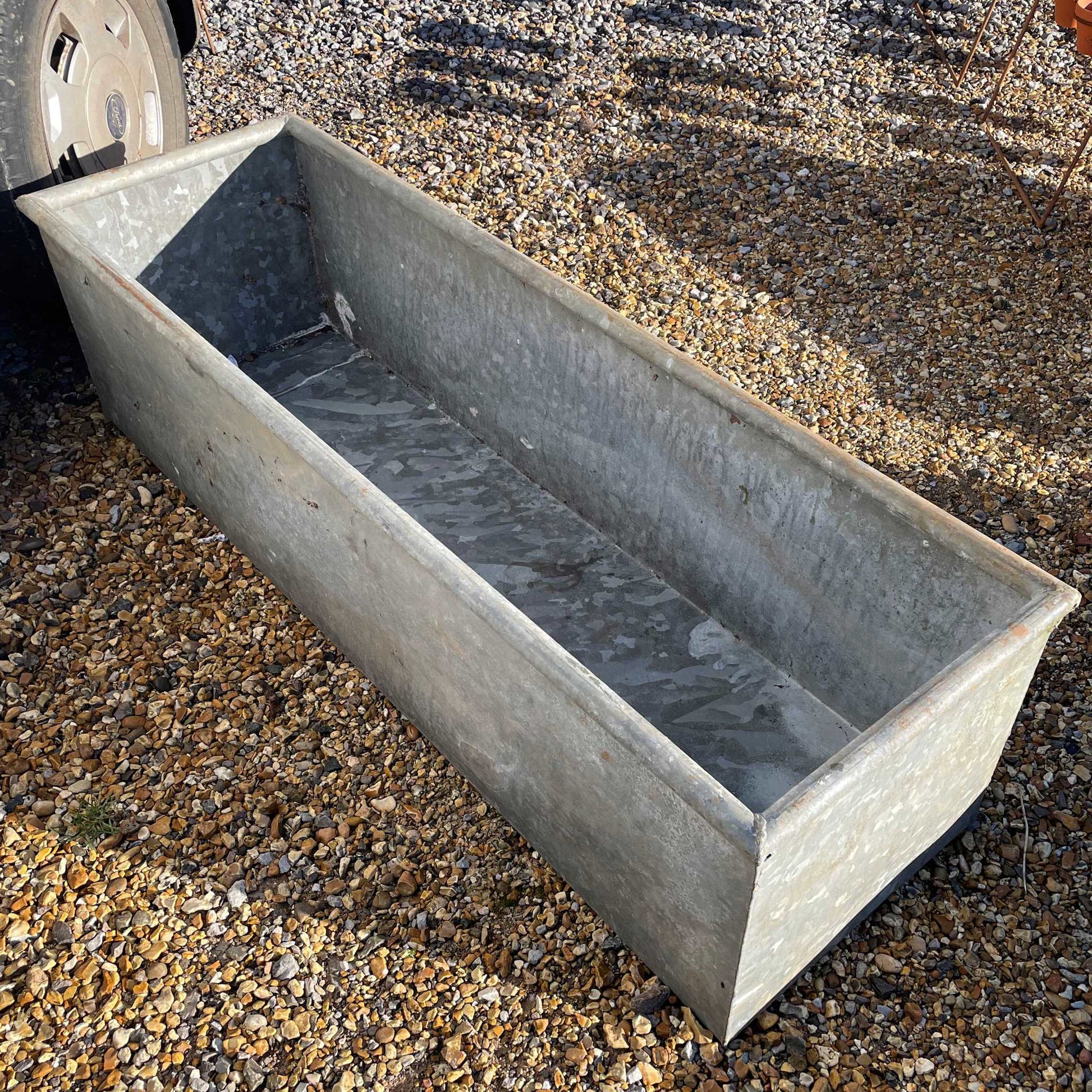 Galvanised water trough planter water feature.