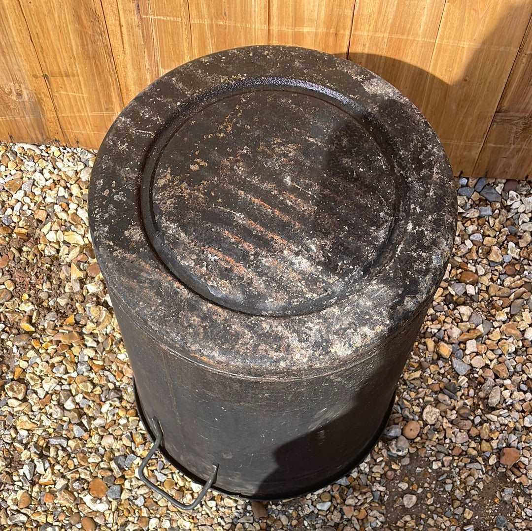 Rustic round galvanised bin garden planter with black aged paint.