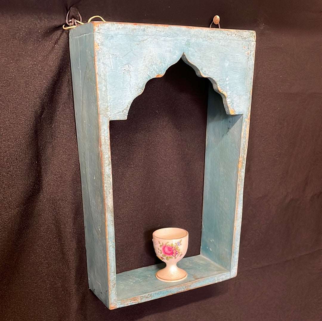 Single Indian blue wooden temple shelf.