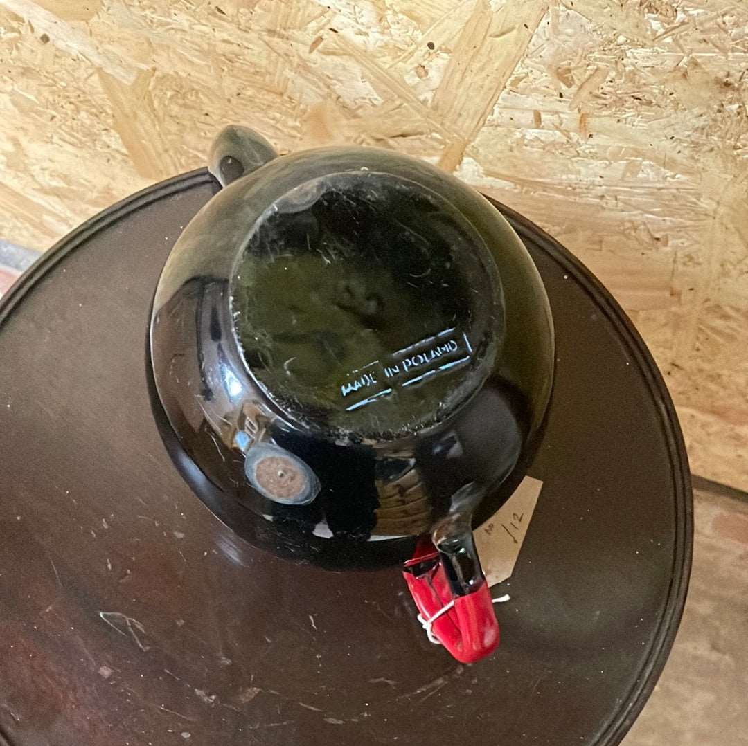 Black enamel tea pot without lid.