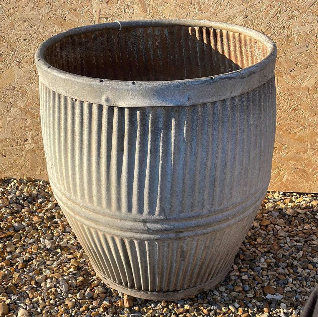 Vintage dolly tub planter ribbed with side handles.