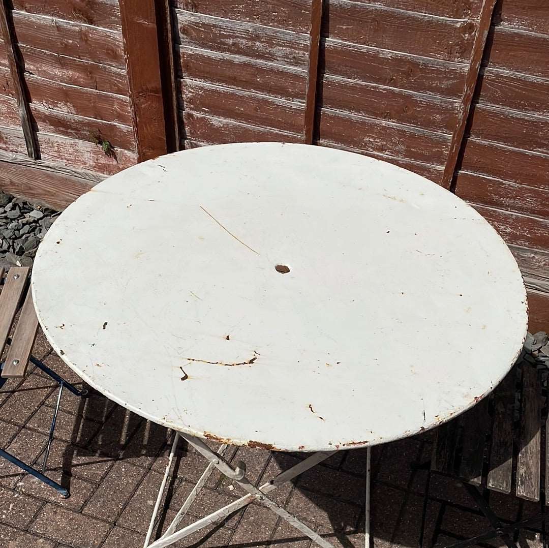 Vintage French round folding bistro table.