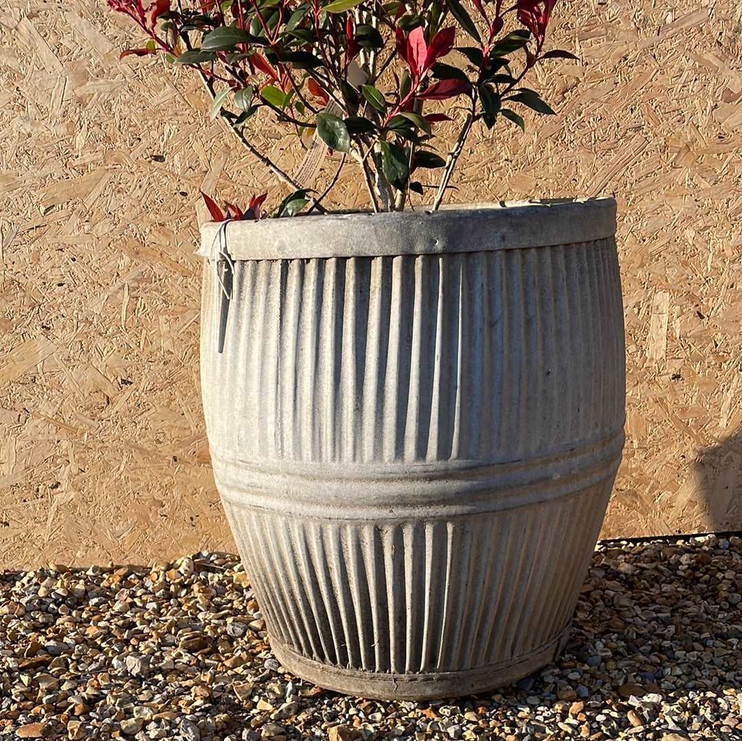 Vintage dolly tub planter ribbed with side handles.