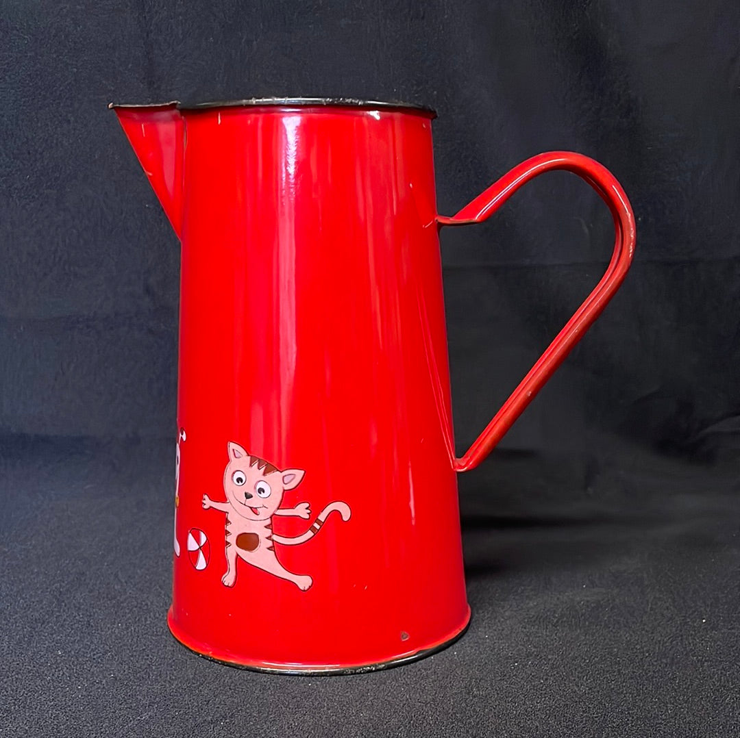 Red enamel 2 litre jug with cartoon characters.