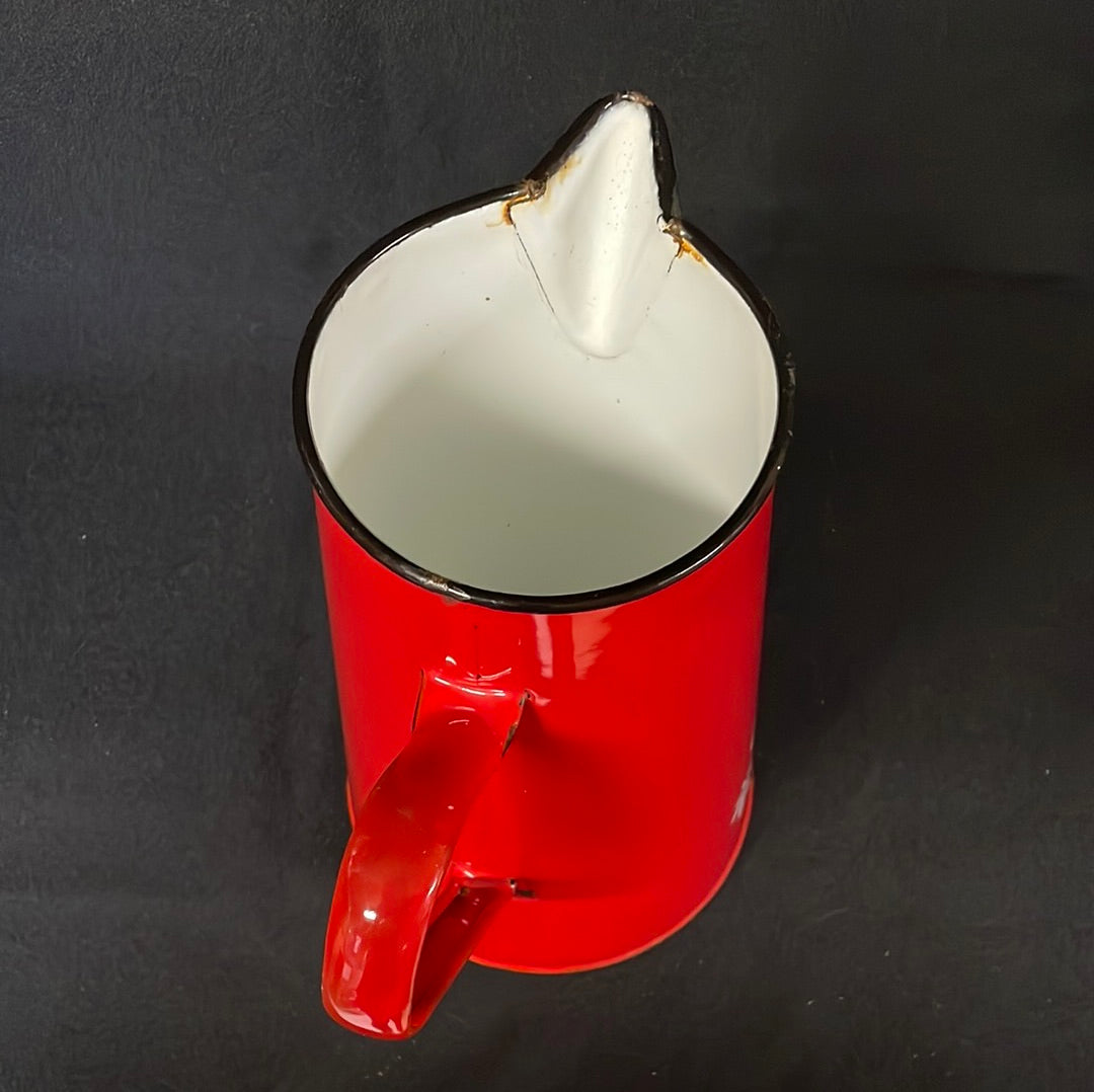 Red enamel 2 litre jug with cartoon characters.