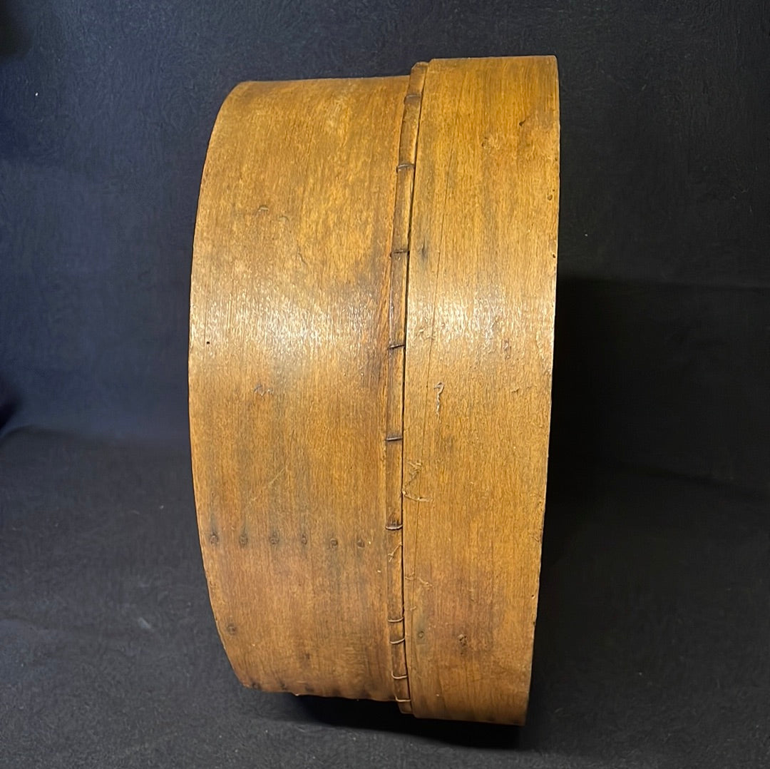 Vintage wooden sided grain sieve.