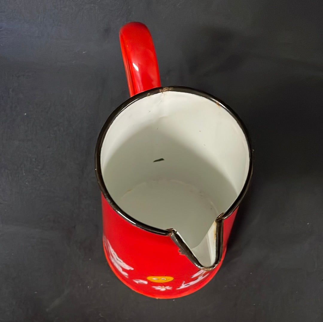 Red enamel 2 litre jug with cartoon characters.