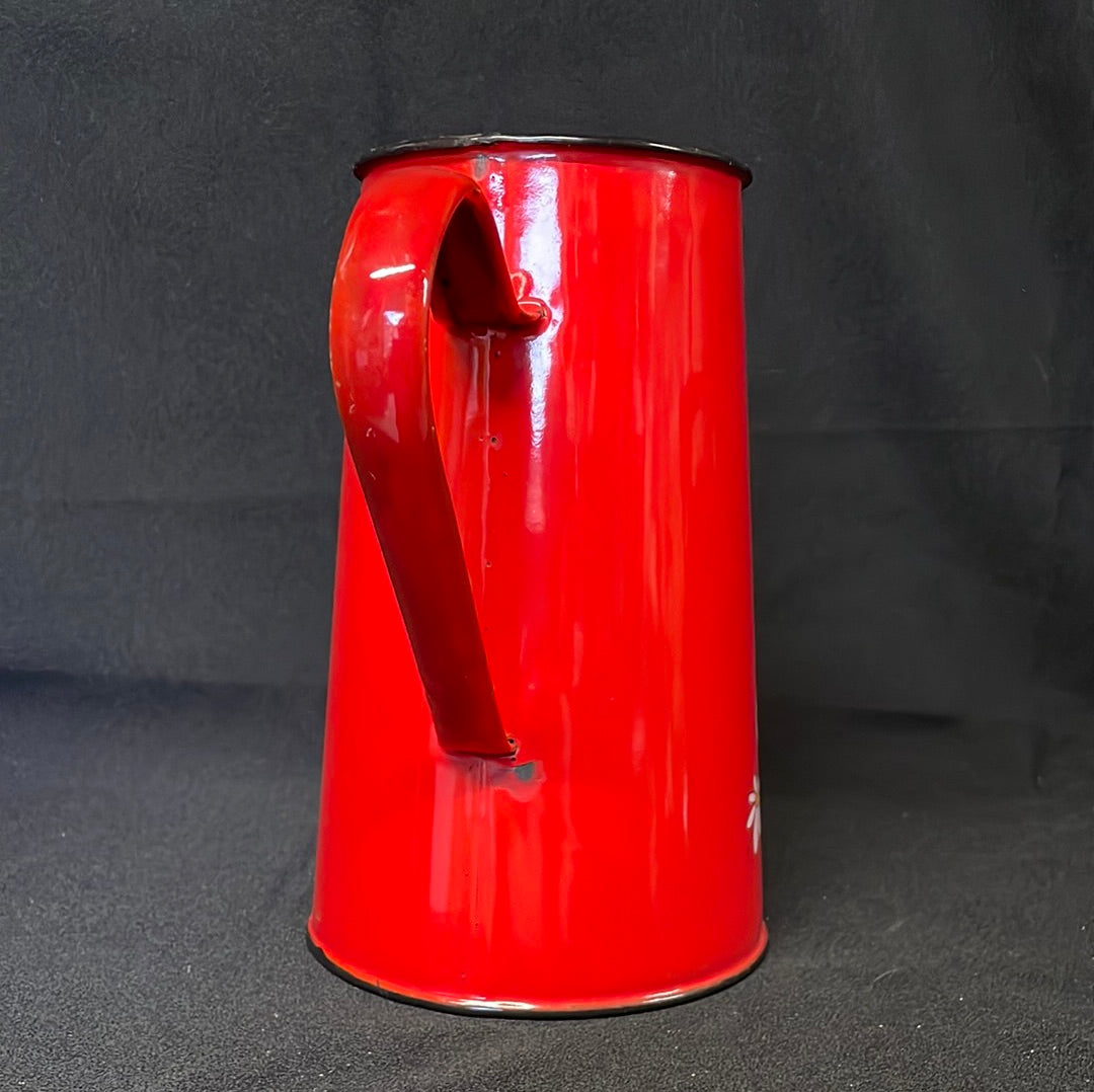 Red enamel 2 litre jug with cartoon characters.