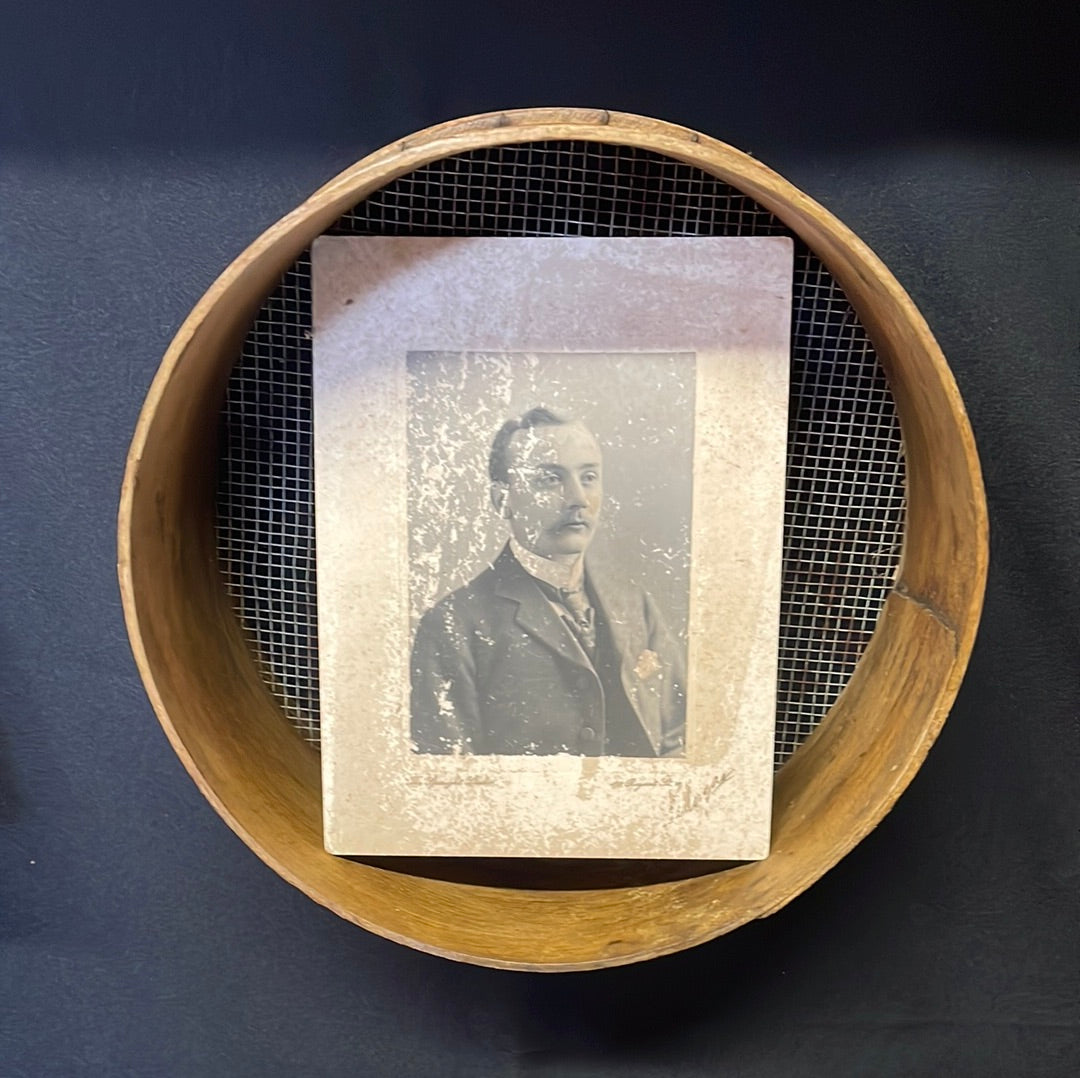 Vintage wooden sided grain sieve.