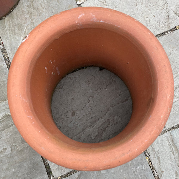 Small terracotta chimney pot.