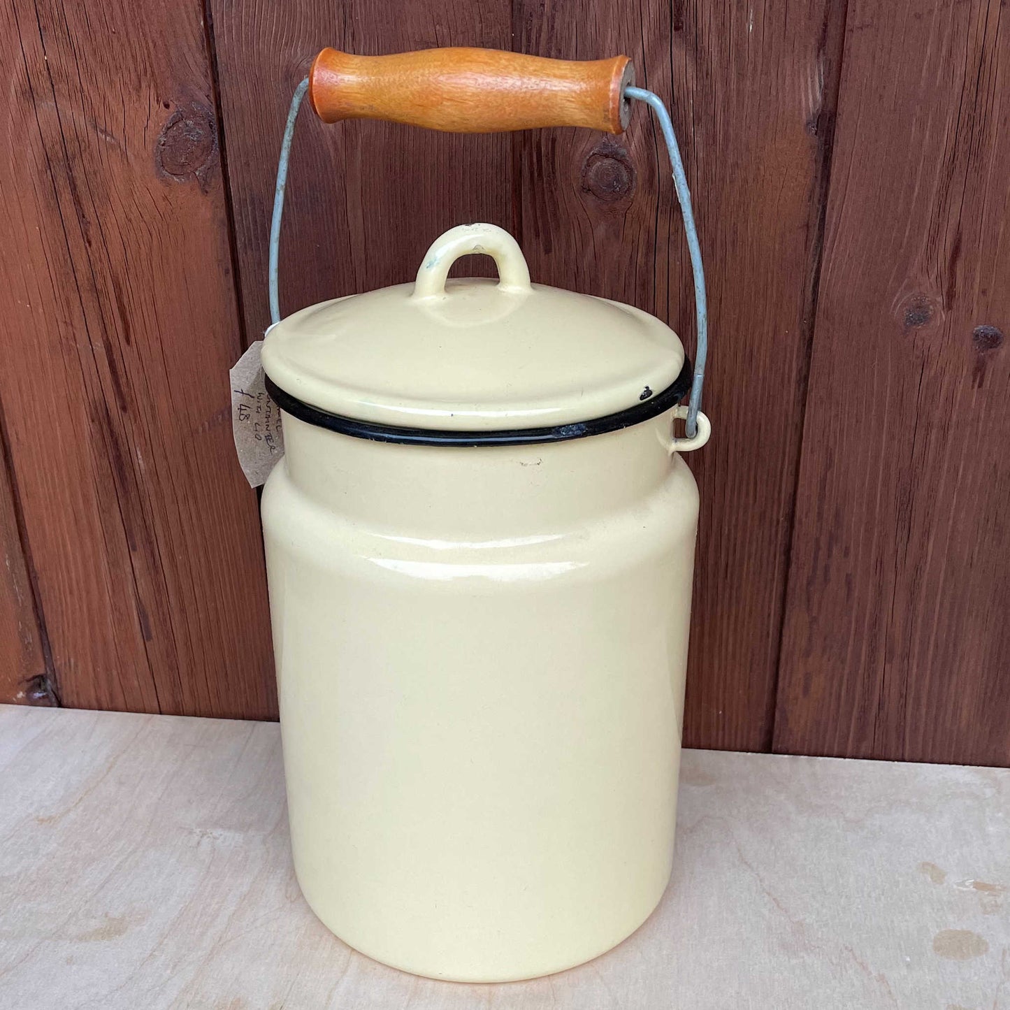 Cream enamelled churn container with lid.