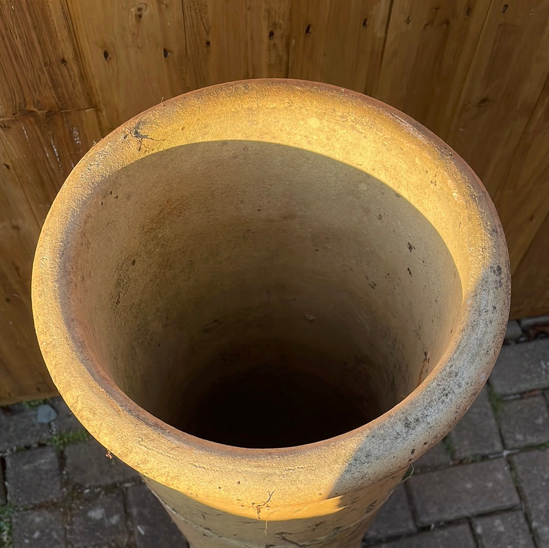 Large vintage pale terracotta chimney pot garden decoration.