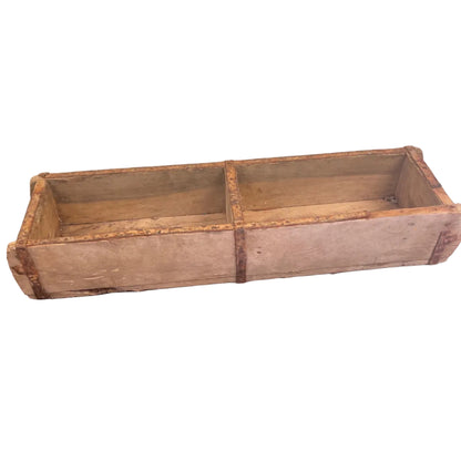 A double Indian brickmould on a white background.