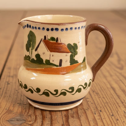 A vintage Watcombe Torquay motto ware cream jug.