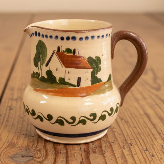 A vintage Watcombe Torquay motto ware cream jug.