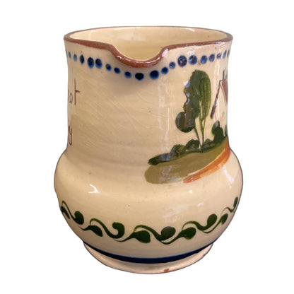 A vintage Watcombe Torquay motto ware cream jug.