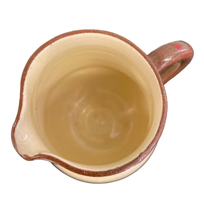 A vintage Watcombe Torquay motto ware cream jug.