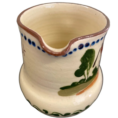 A vintage Watcombe Torquay motto ware cream jug.