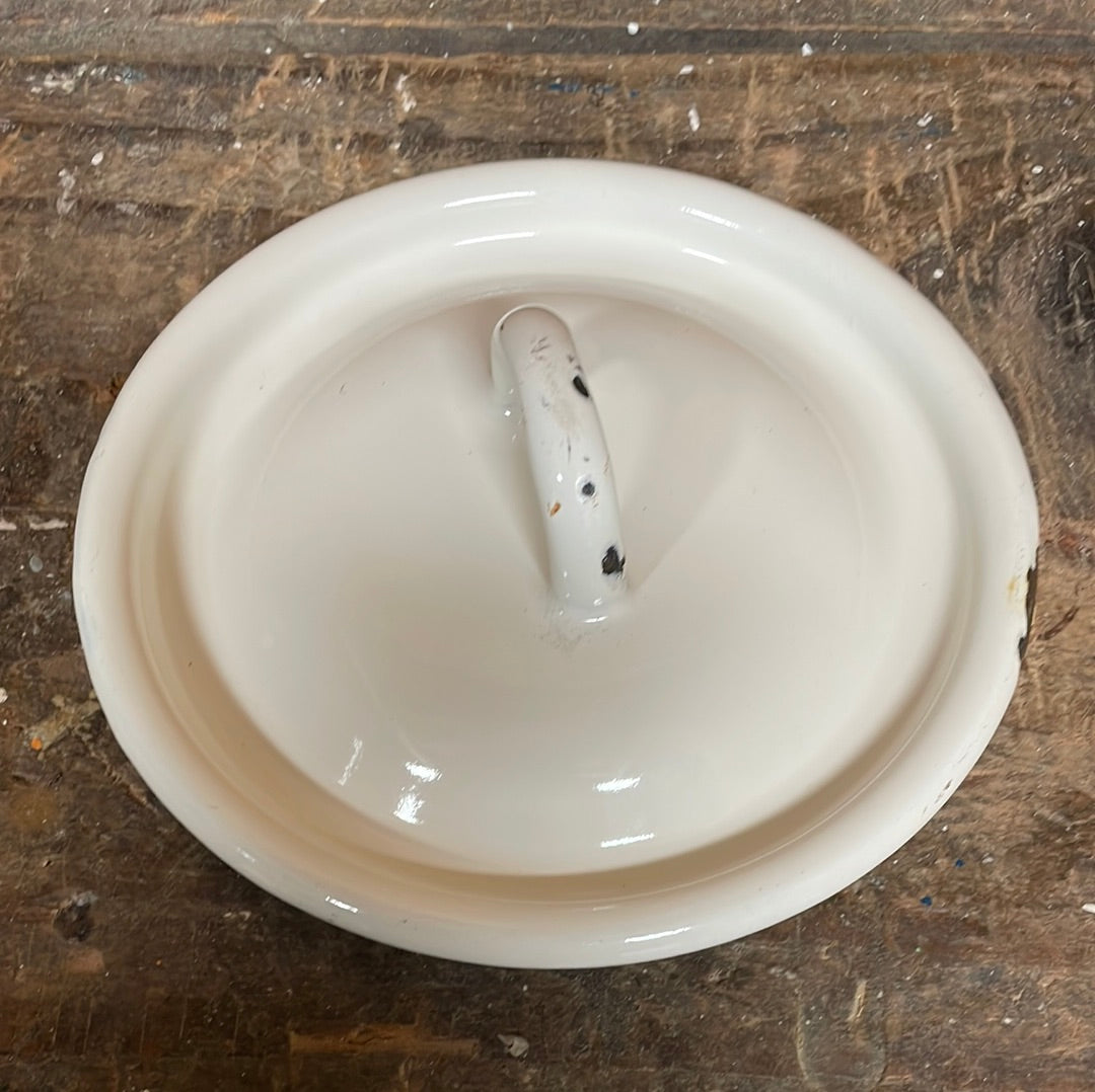White enamel pot with handle and lid, sunflower décor.