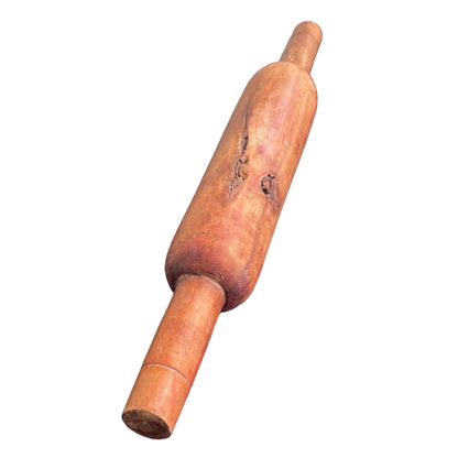 Indian wooden rolling pin on a white background.