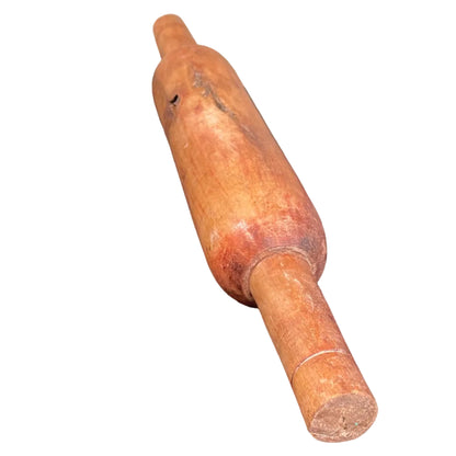 Indian wooden rolling pin on a white background.