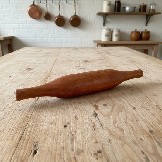 Indian wooden rolling pin in a kitchen.