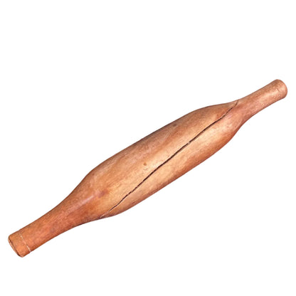 Indian wooden rolling pin on a white background.