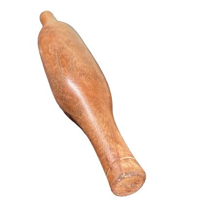 Indian wooden rolling pin on a white background.