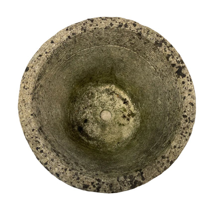 Ornate concrete planter with geometric pattern against a white background.
