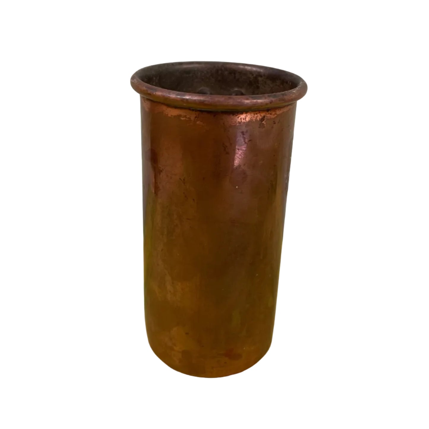 Vintage copper measuring cup against a white background.