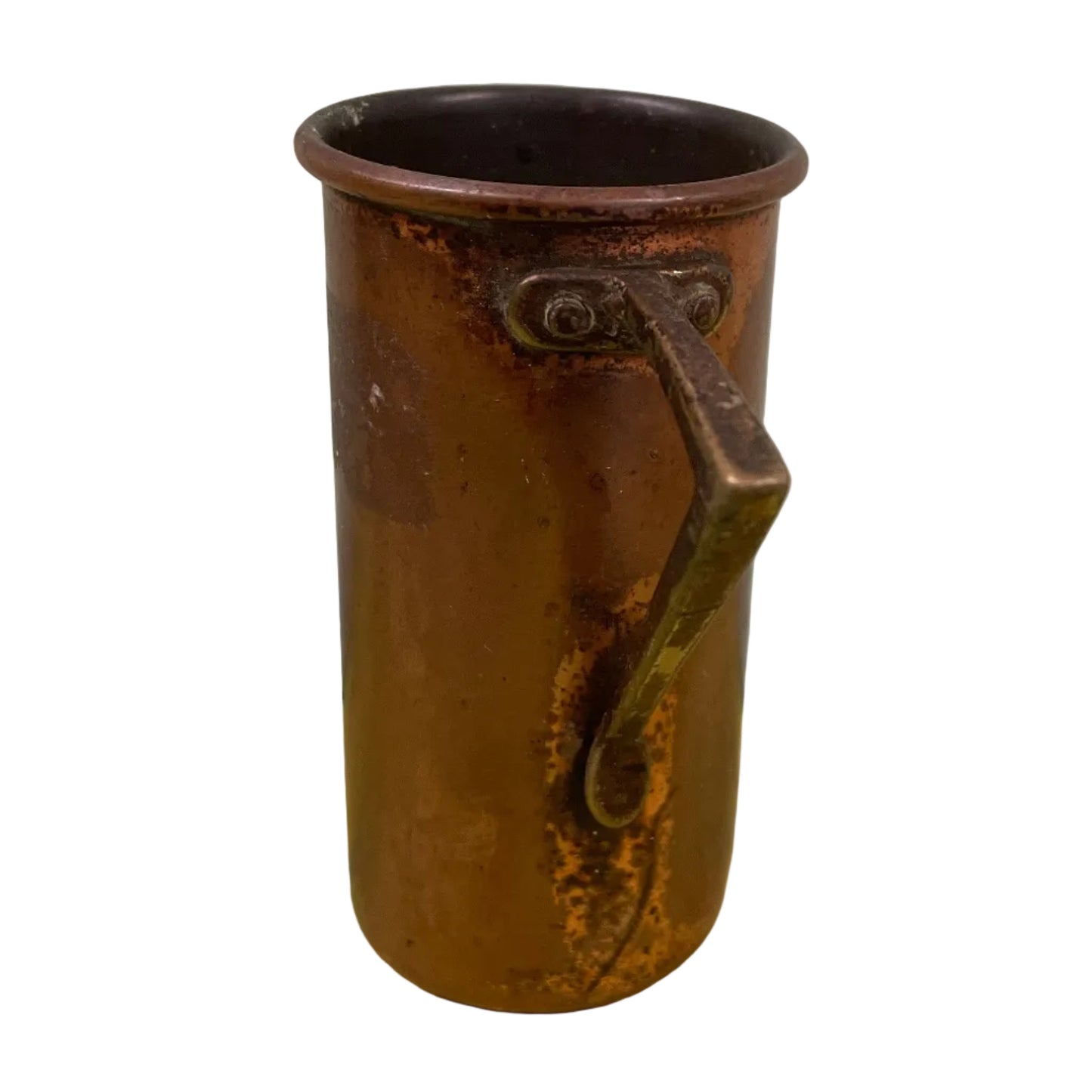 Vintage copper measuring cup against a white background.