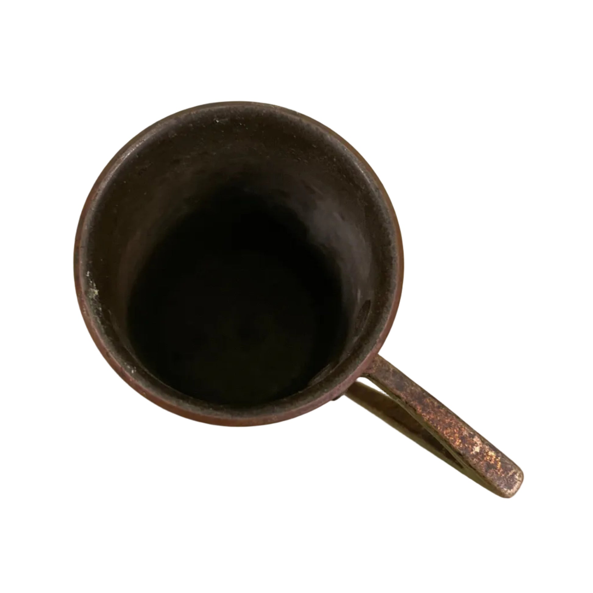 Vintage copper measuring cup against a white background.