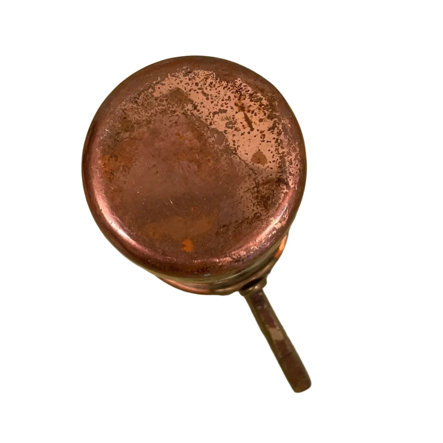 Vintage copper measuring cup against a white background.