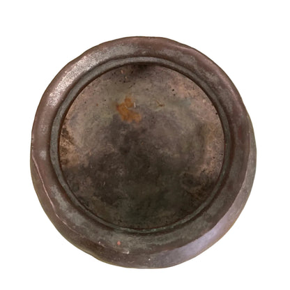Indian copper cooking pot on white background.