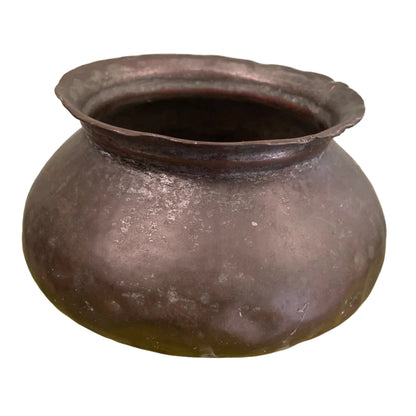 Indian copper cooking pot on white background.