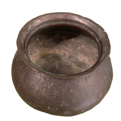 Indian copper cooking pot on white background.
