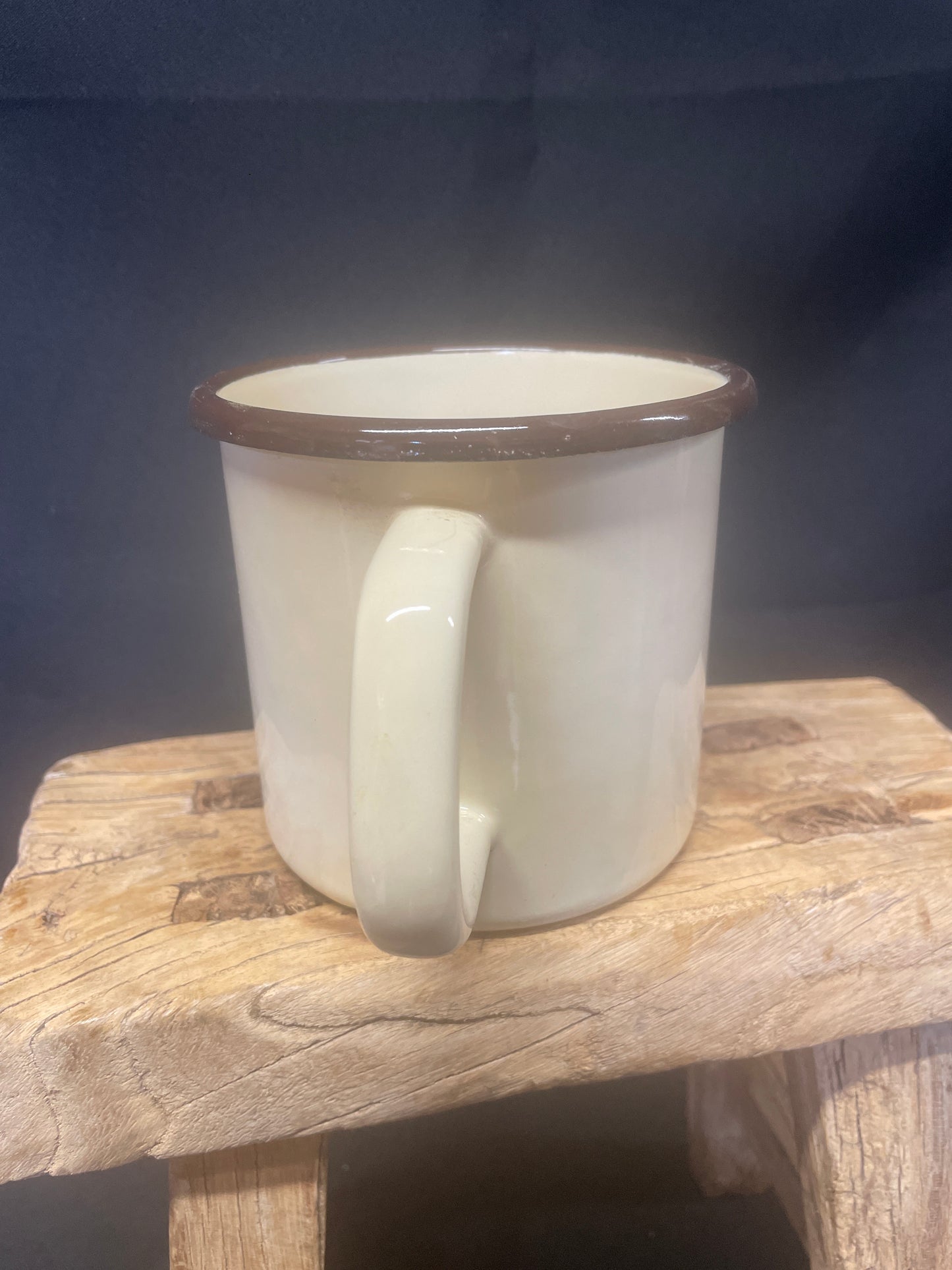 Large cream enamel mug with sunflowers decor.