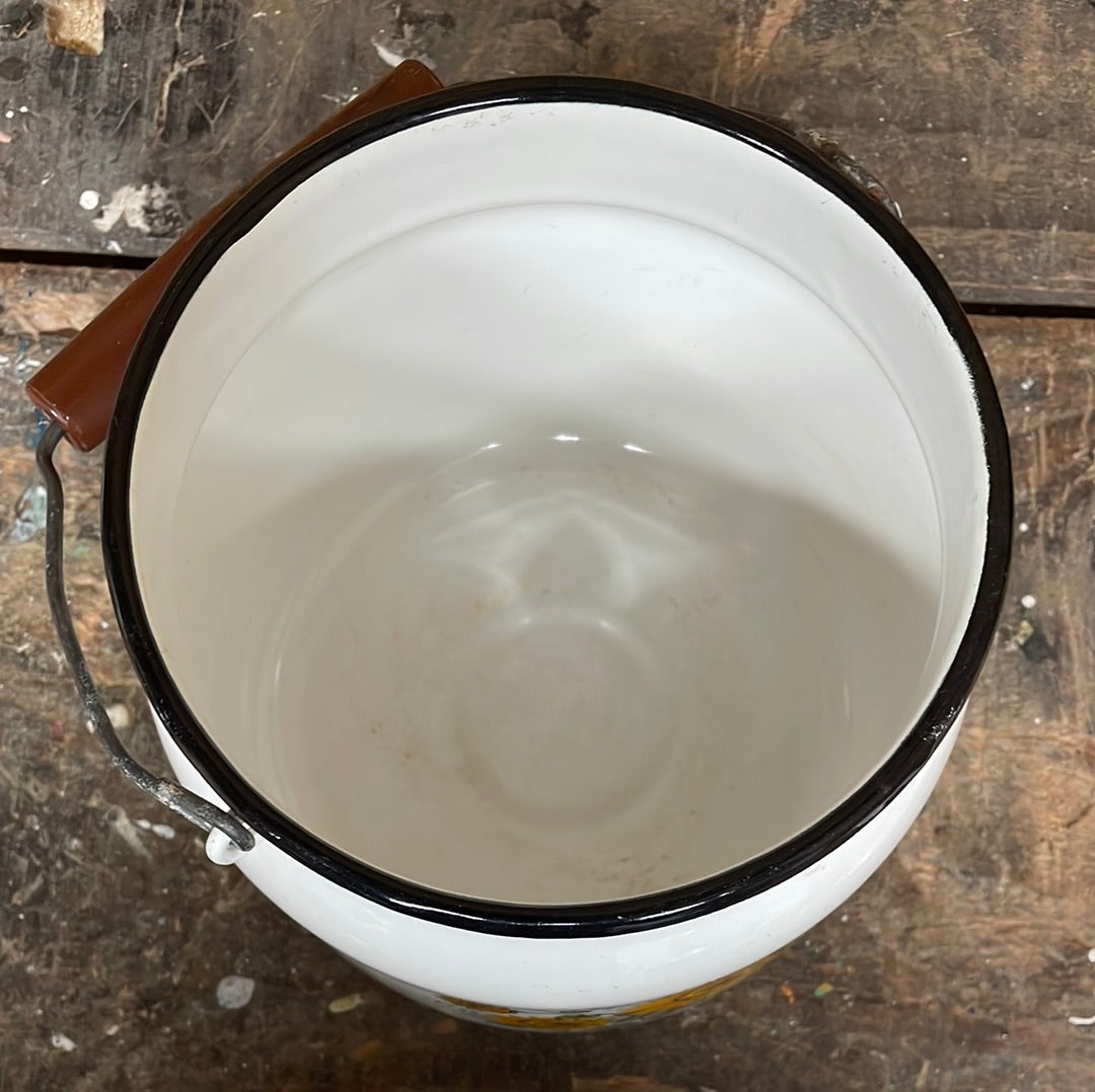 White enamel pot with handle and lid, sunflower décor.