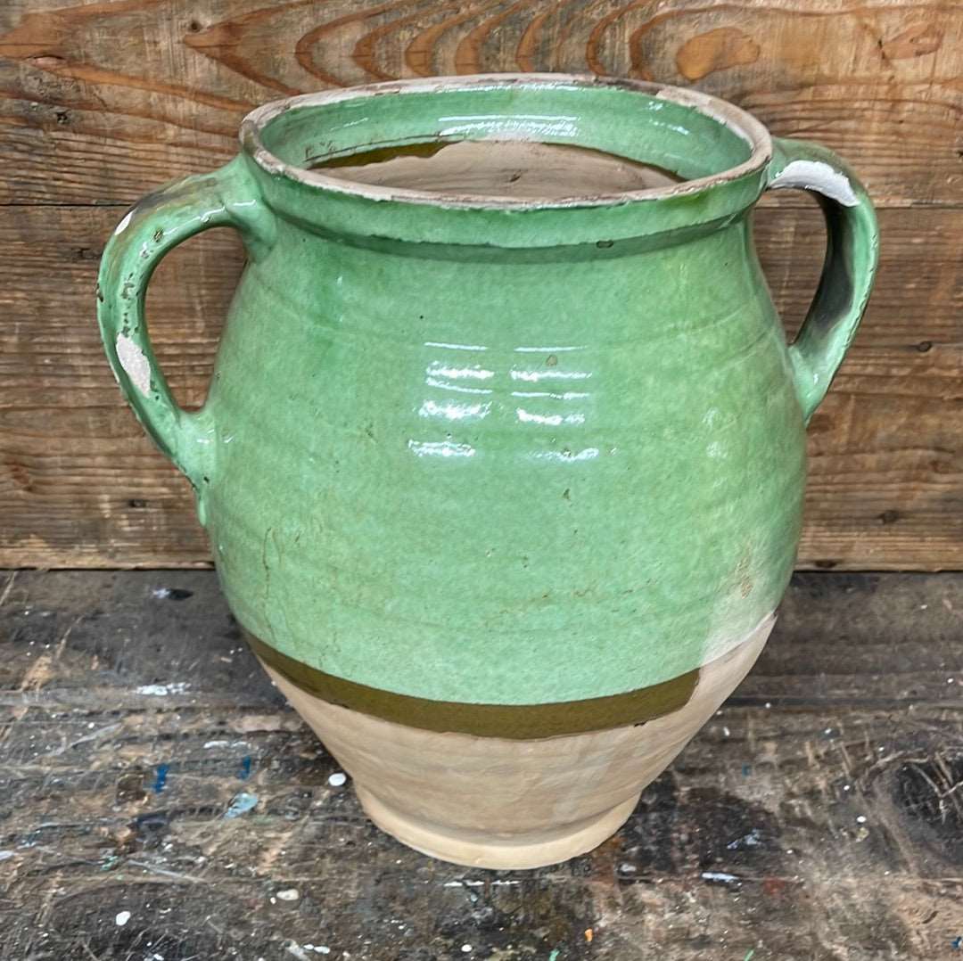 Hungarian hand thrown terracotta part glazed urn pot with two handles.